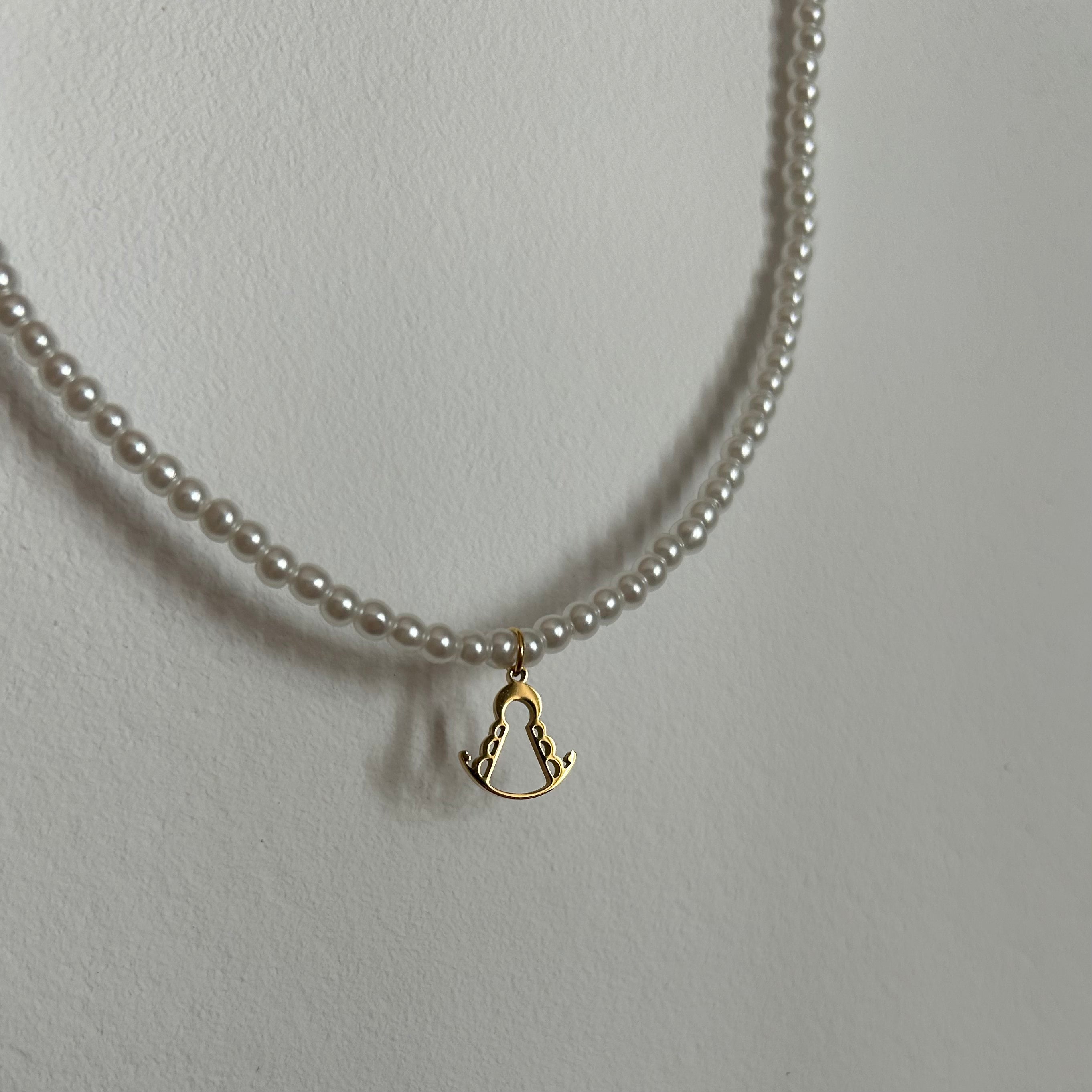 Virgin of Rocio pearl necklace